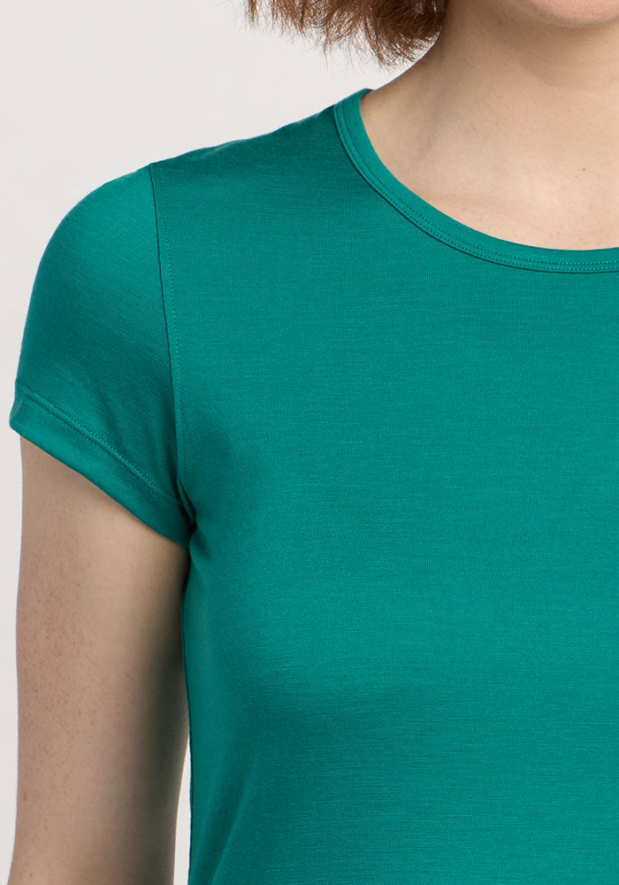 Person wearing the Woolx Addie Crew Neck in Cabana Crush; only shoulder, chest, and part of neck are visible.