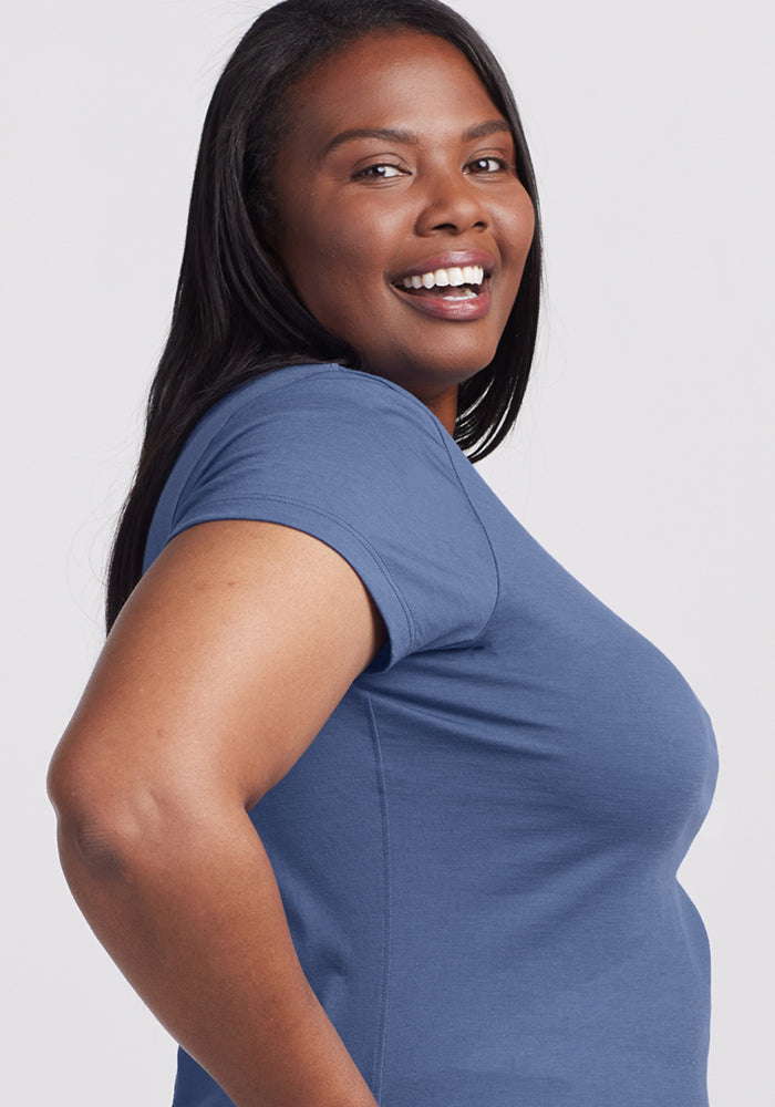 Smiling woman in a Woolx Addie Crew Neck - Skyline, posing against a light background. Final Sale.
