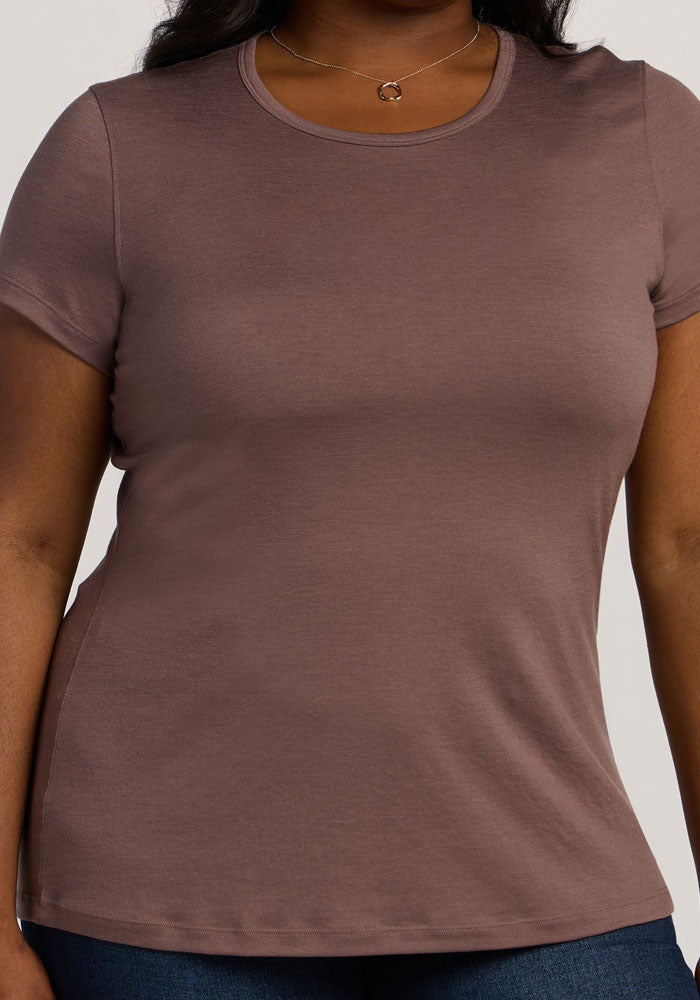 Someone wears the Woolx Addie Crew Neck in Peppercorn with blue jeans, shown from shoulders to hips.
