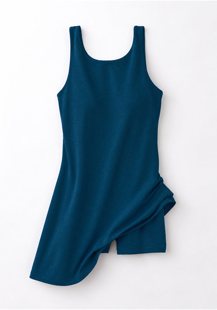 Woolx Adrienne Active Dress in Majolica Blue with scoop neck and built-in shorts, displayed on a white background.