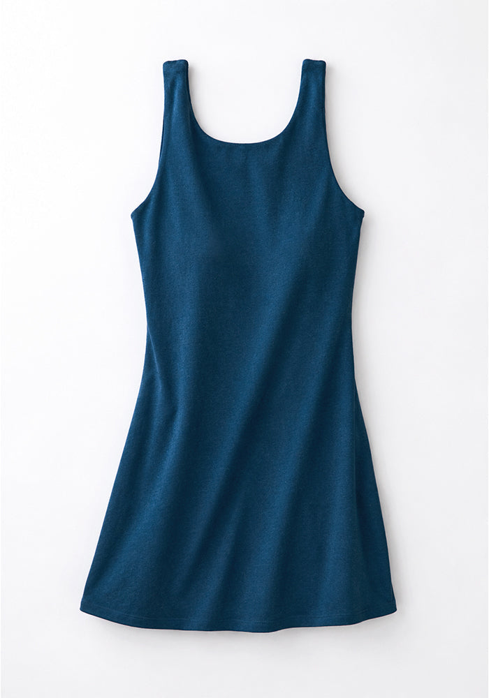 The Woolx Adrienne Active Dress in Majolica Blue, sleeveless with built-in bra, shown flat on a white background.