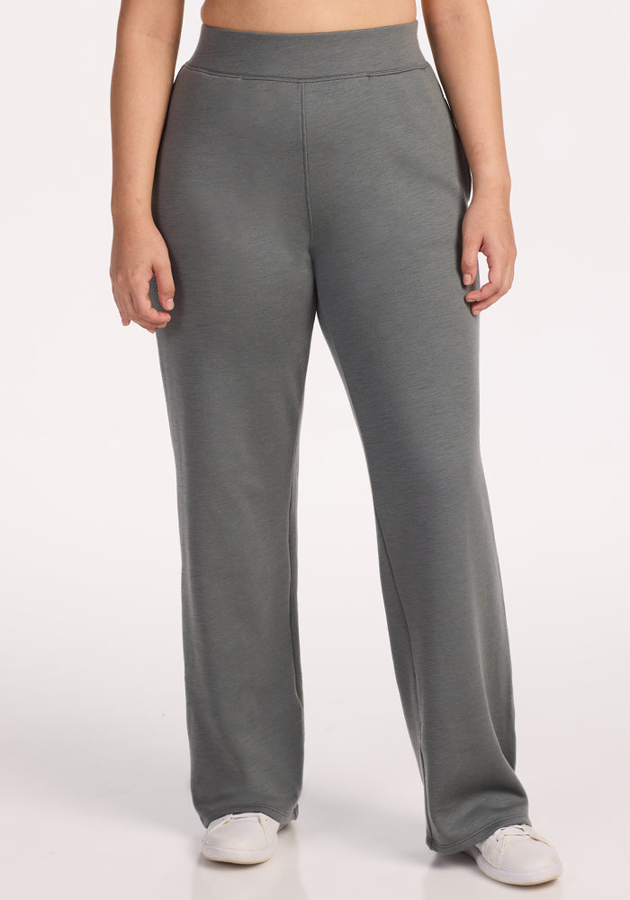 A person models the Woolx Bree Lounge Pants in Sedona Sage, standing against a plain white background with arms relaxed at their sides.