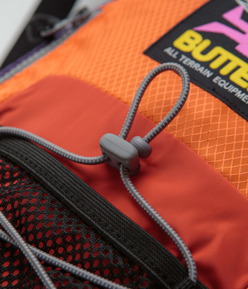 Butter Goods Express Shoulder Bag in Orange and Navy