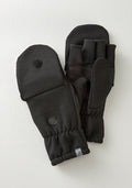 The Cameron Glove Mitten in black from Woolx is displayed on a light surface. Made with a Merino wool blend, these mittens provide exceptional warmth. They feature visible finger slots under the mitten cover, which can be folded back and secured with Velcro. Ribbed cuffs and a small logo tag offer subtle detailing.