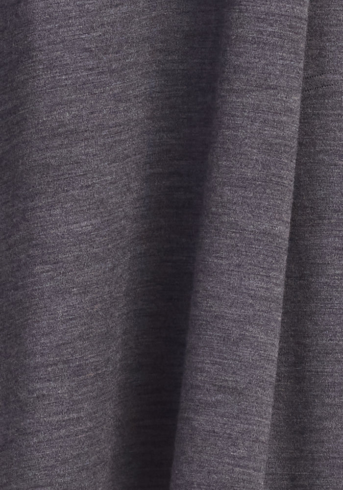A close-up of Woolx’s Cassie Dress in Cinder Melange, showing wrinkle-resistant, heathered gray fabric.