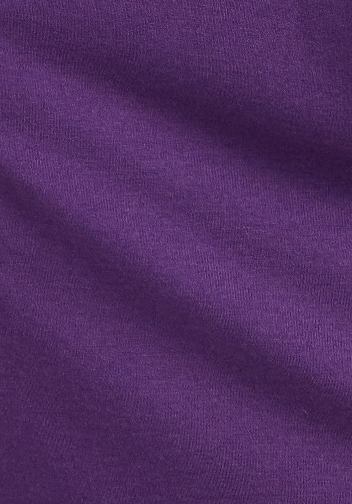 Close-up of Woolx Cassie Dress in Plum Crush: smooth, wrinkle-resistant fabric with subtle, soft folds.