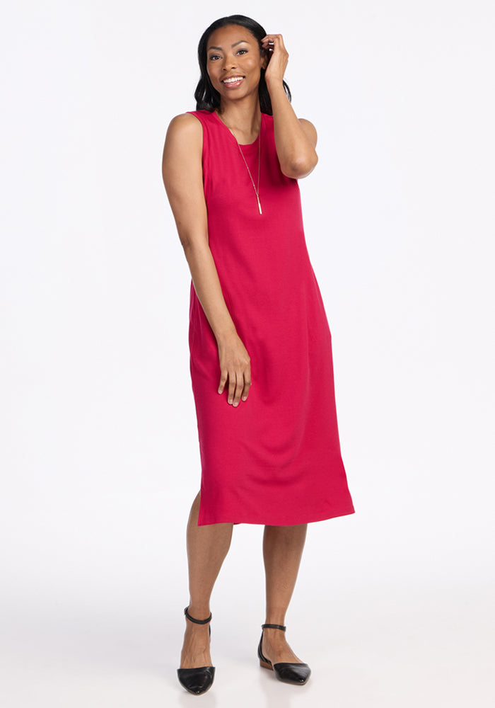 Smiling woman in the Woolx Cassie Dress • Final Sale - Poppy Spark, standing against a white background.