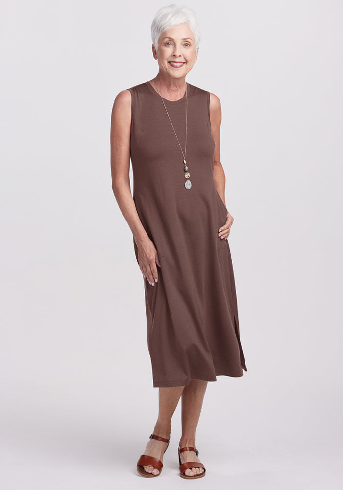 Smiling older woman in the Woolx Cassie Dress - Peppercorn looks effortlessly stylish and comfortable. | Kathy is 5’9”, wearing a size S