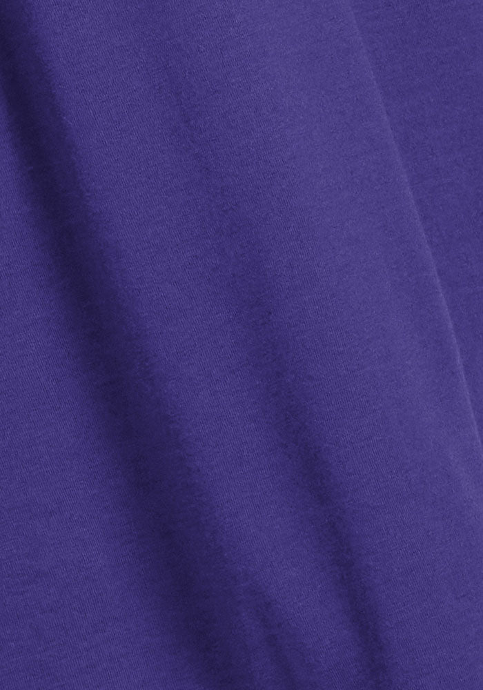 Close-up of Woolx Clara Dress - Berry Indigo: soft, breathable fabric with subtle diagonal folds, ideal for summer.