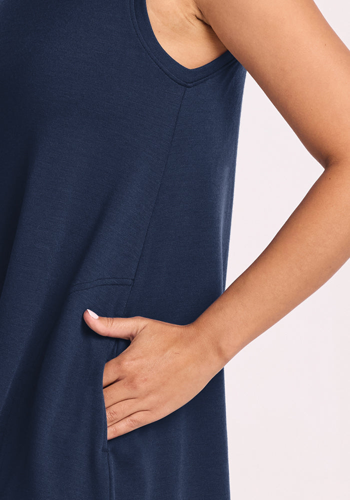 Someone wearing the Woolx Clara Dress in Deep Navy with their hand in the side pocket.