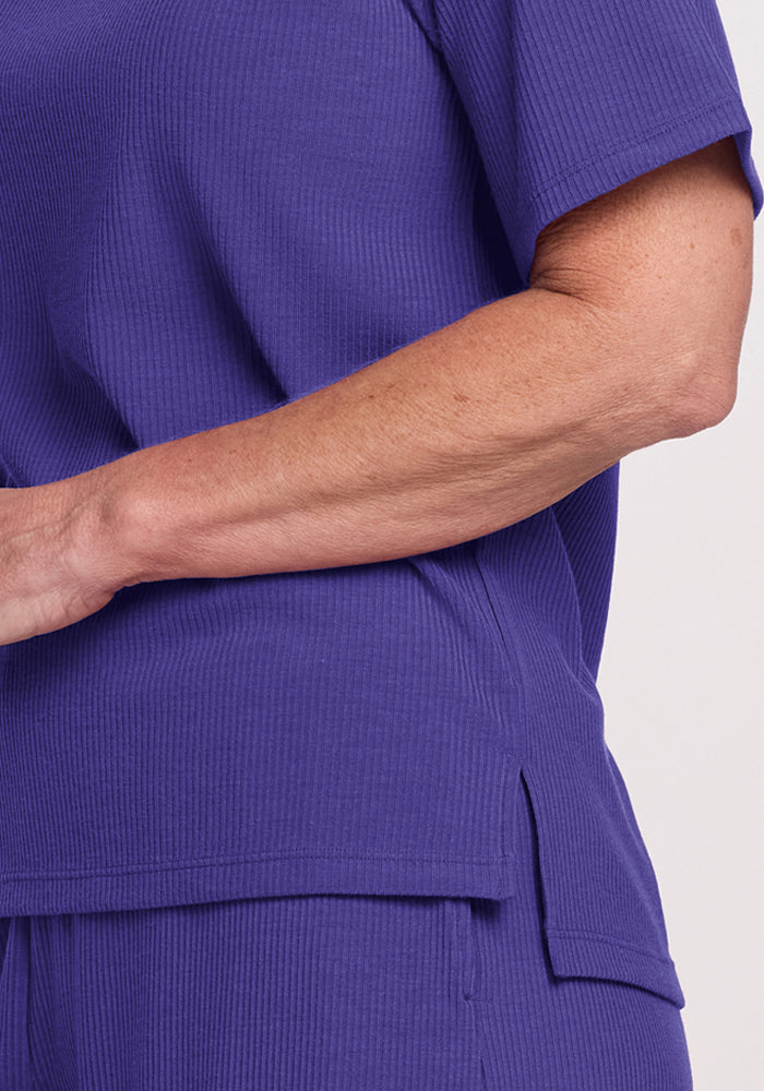 Model in Woolx Delia Ribbed Short Sleeve - Berry Indigo, relaxed fit, shown shoulder to hip.