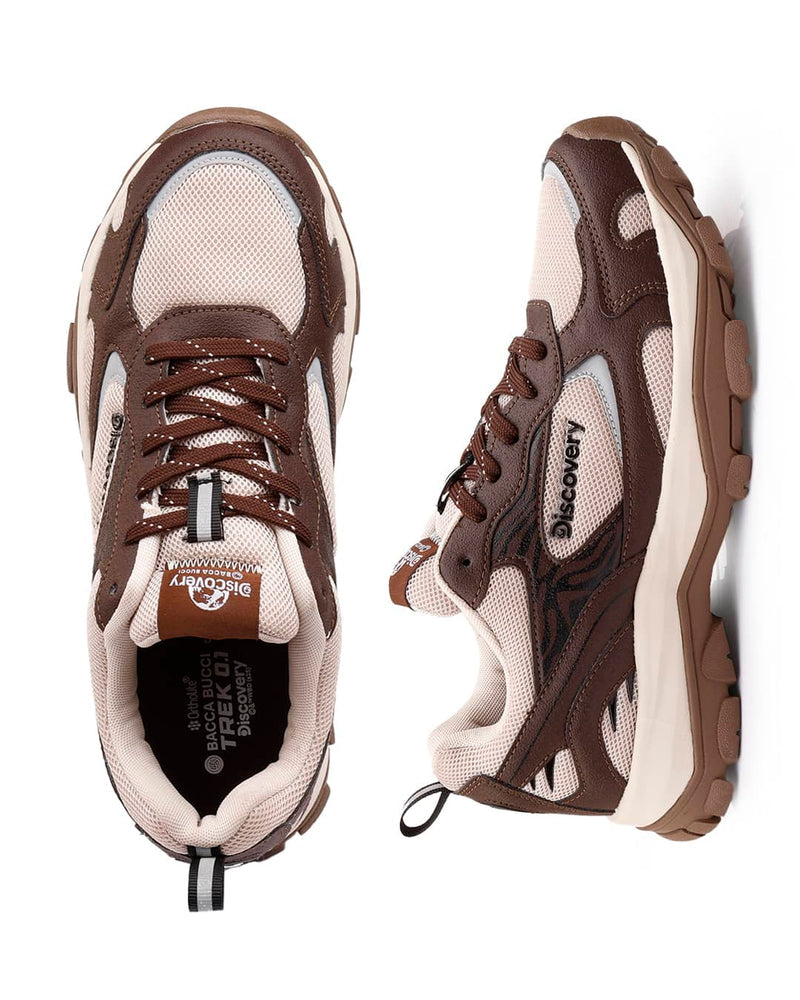 Brown and beige sneakers with 'Discovery' branding on a white background
