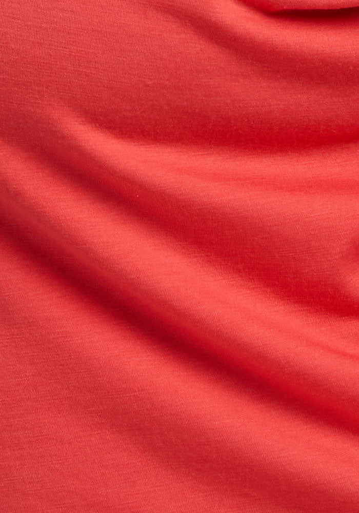 Close-up of Woolx Elena 3/4 Sleeve V Neck—Hibiscus merino wool with soft folds and visible texture.
