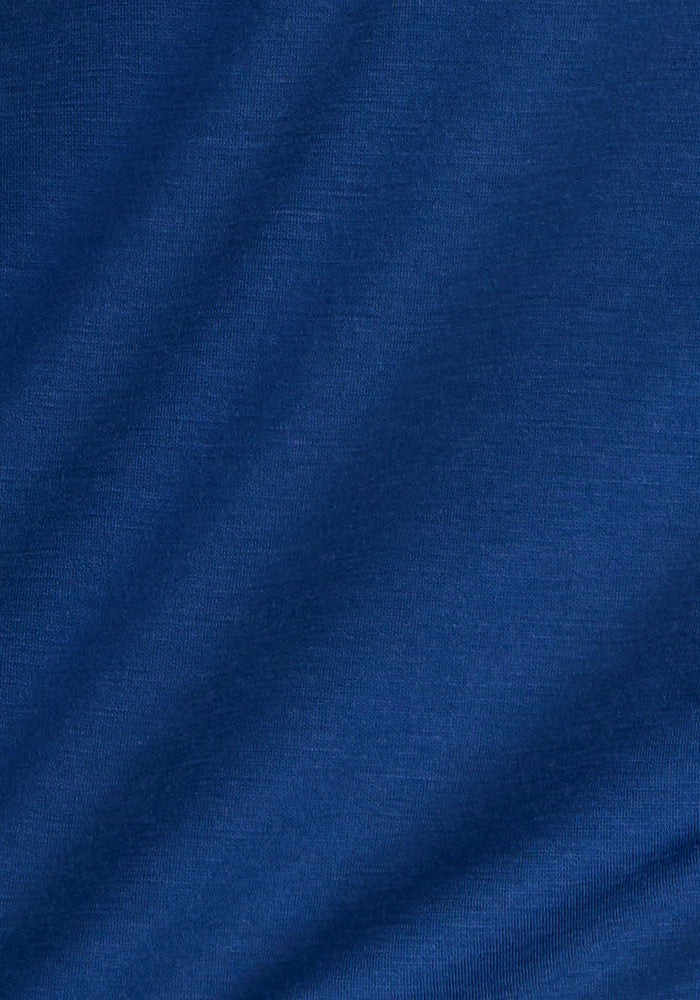 Close-up of the Woolx Endi Full Button Down Shirt in Estate Blue, highlighting its smooth, lightweight fabric with a subtle diagonal texture and gentle folds.