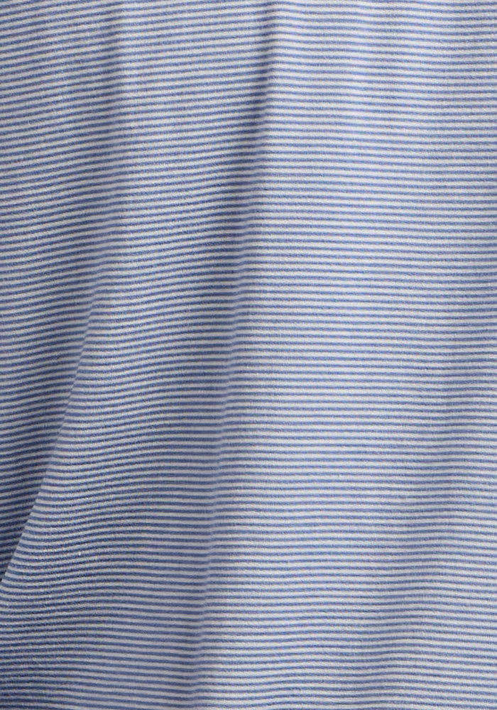 Close-up of Woolx Essential Tee - Blue Sand Mini Stripe fabric with thin white pinstripes and light folds.