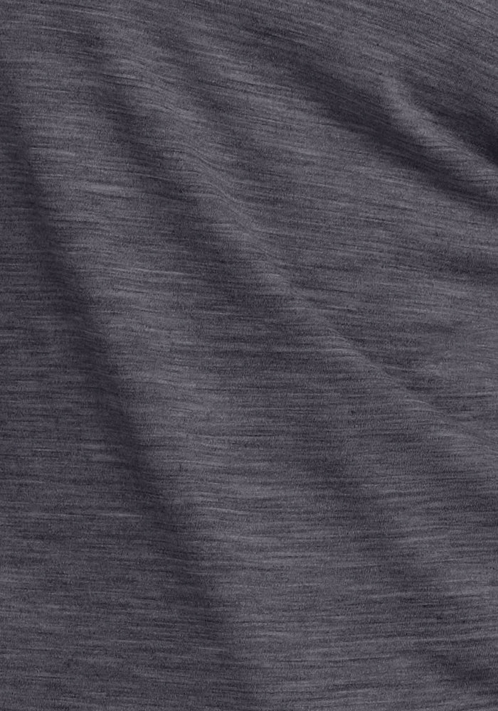 Close-up of Woolx Essential Tee in Cinder Melange, showing heathered Merino wool's soft, temperature-regulating texture.