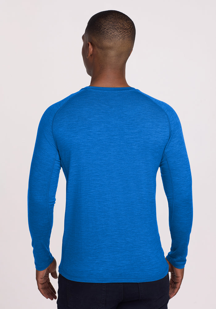 Man facing away, wearing Woolx Essential Tee • Final Sale - Glacial Blue, against a plain background.