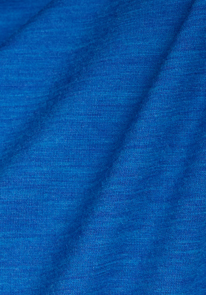 Close-up of Woolx Essential Tee in Glacial Blue, featuring temperature-regulating fabric and visible texture.