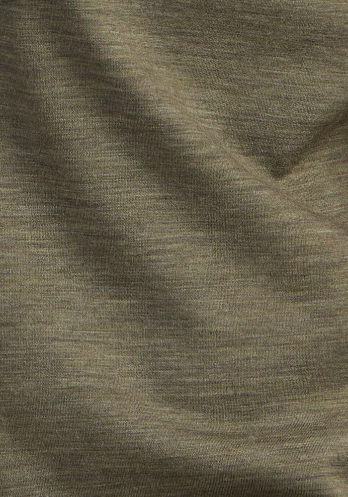 Woolx Essential Tee in Sage Olive Melange: soft, temperature-regulating Merino with subtle folds and long sleeves.