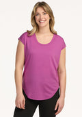 Woman smiling in the Woolx Gabi Tunic Top – Purple Wine, standing against a plain white background.