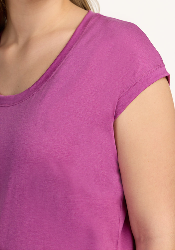 Model in Woolx Gabi Tunic Top, short-sleeve scoop-neck in Purple Wine, shown shoulders to upper chest.