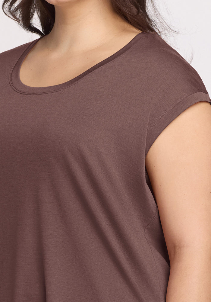 A woman wearing the Woolx Gabi Tunic Top in Peppercorn, featuring short sleeves and a scoop neck.