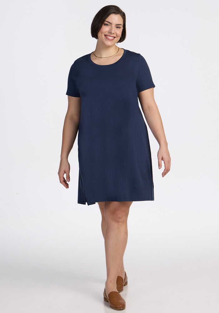 Woman wearing the Woolx Georgie Dress in Deep Navy, standing against a plain white background.
