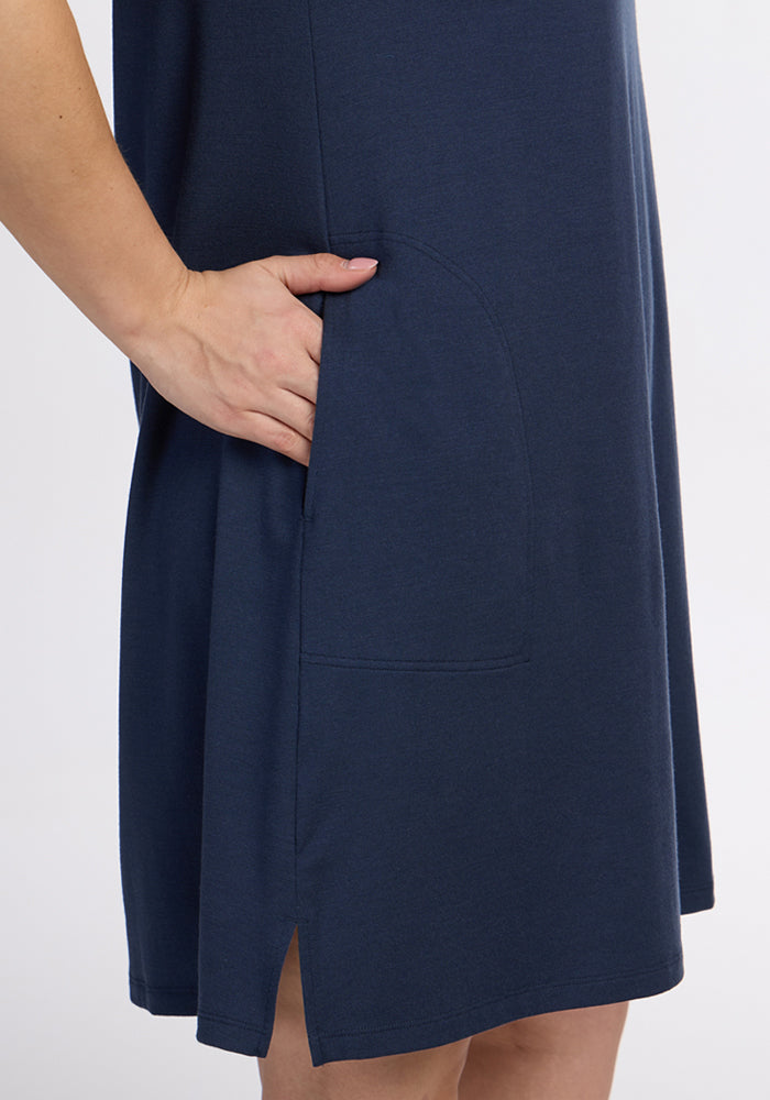 Model wearing the Woolx Georgie Dress • Final Sale - Deep Navy, hand in large side pocket, shown waist down.