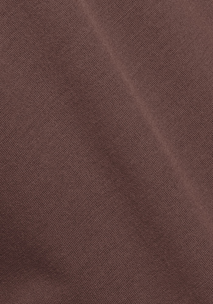 Close-up of Woolx Georgie Dress - Peppercorn, highlighting its soft Merino wool fabric, fine weave, and diagonal seam.