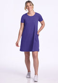 Smiling woman in Woolx Georgie Dress - Berry Indigo: short-sleeve, knee-length, pockets, white sneakers. | Ariana is 5'11", wearing a size S
