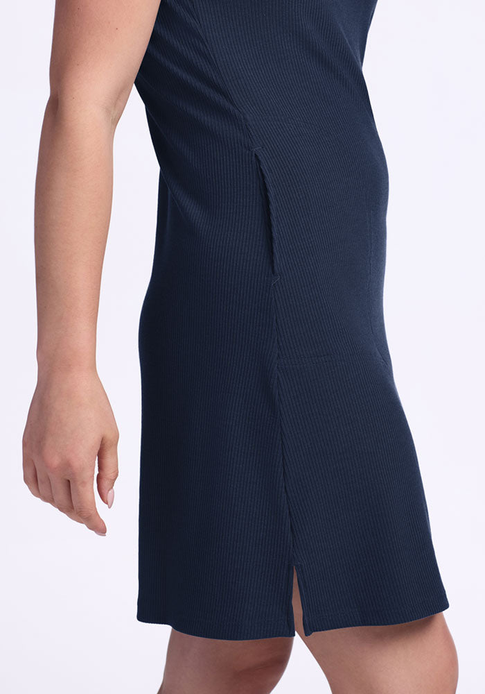 Model wears Woolx Harlowe Ribbed Dress in Deep Navy, shoulder to knee view, against a plain background. Final Sale.