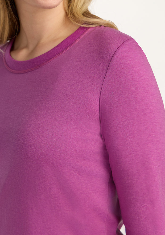 Woman wearing the Woolx Hazel Tunic in Purple Wine, long-sleeved, shown from shoulders up against a plain background.