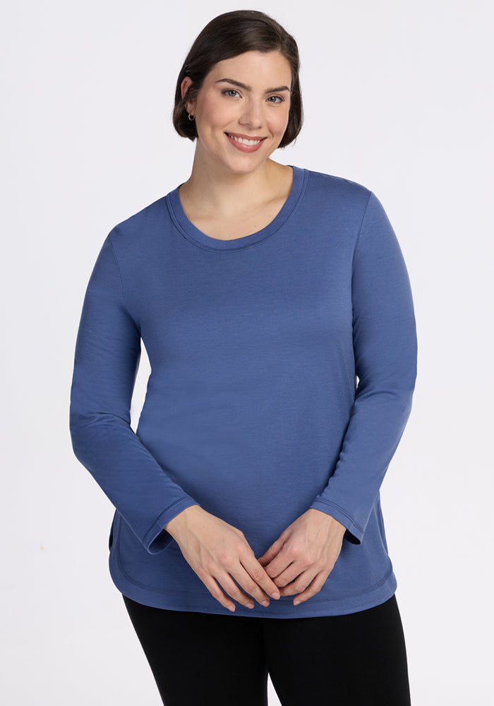 Woman with short brown hair smiles at the camera wearing the Woolx Hazel Tunic • Final Sale - Skyline.