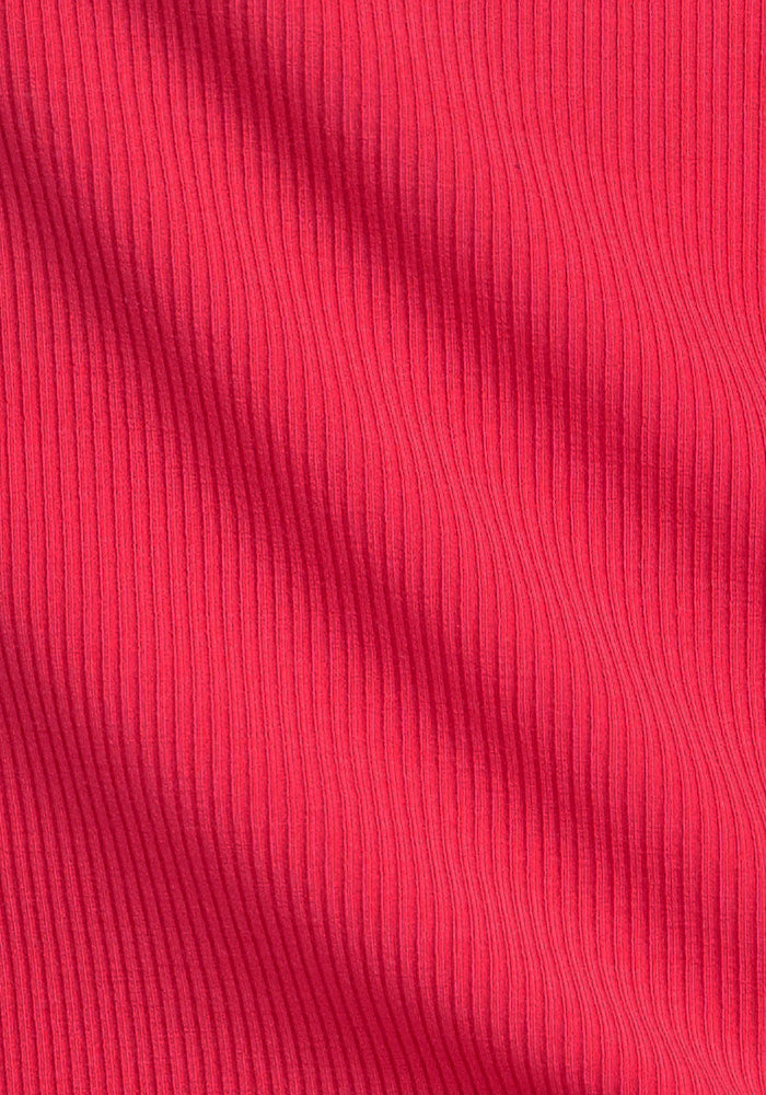 Close-up of Woolx Iris Ribbed Dress - Berry Ice Pop fabric with vertical rib texture and soft, wavy shadows.