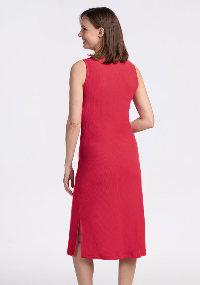 Woman models the Woolx Iris Ribbed Dress in Berry Ice Pop, shown from the back against a plain background.