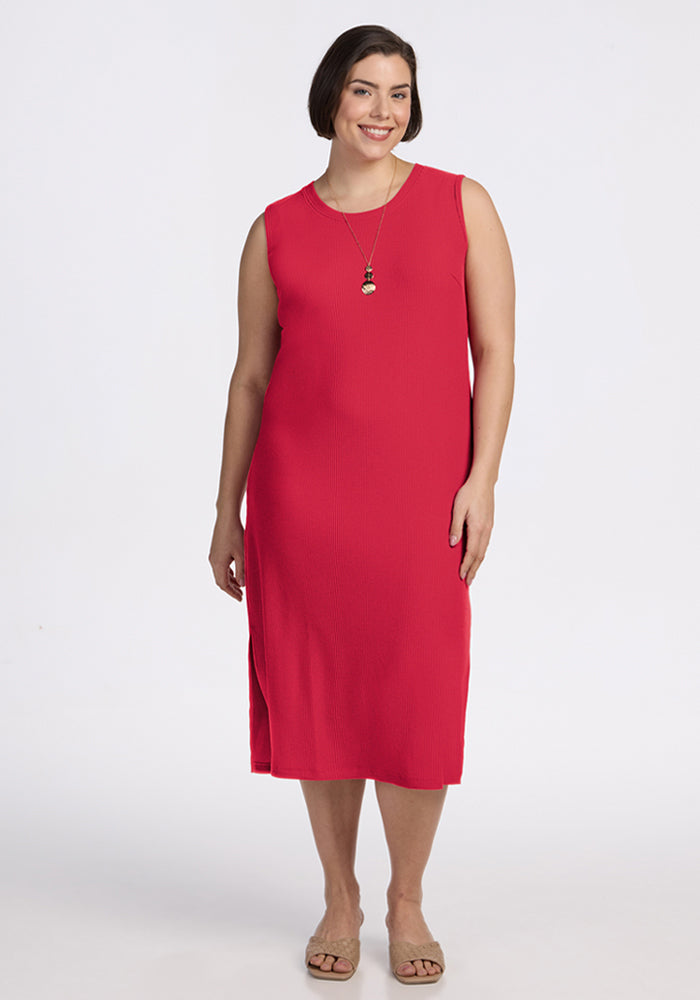 Woman wearing the Woolx Iris Ribbed Dress in Berry Ice Pop, smiling against a white background. | Juliana is 5'10", wearing a size XL