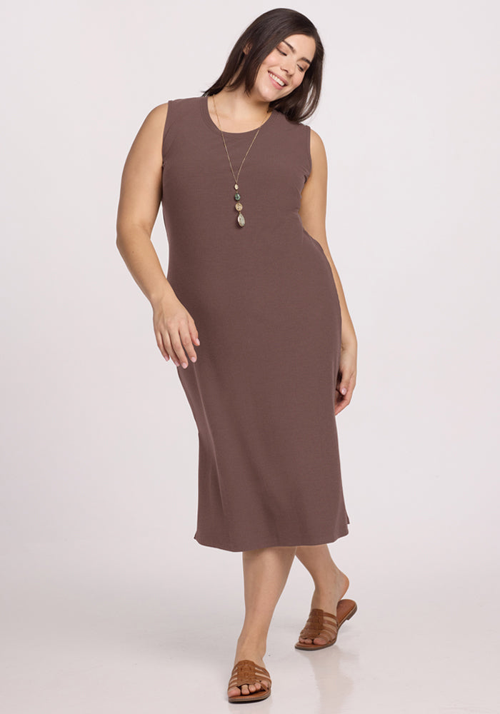 Woman wearing the Woolx Iris Ribbed Dress in Peppercorn, smiling and posing against a plain background.