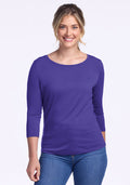 Smiling woman wearing the Woolx Jenny 3/4 Sleeve Crew Neck in Berry Indigo, paired with blue jeans. | Ariana is 5'11", wearing a size S