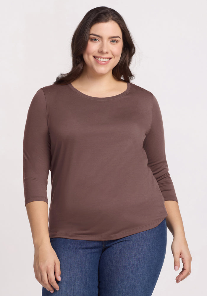 Woman smiling, wearing the Woolx Jenny 3/4 Sleeve Crew Neck in Peppercorn and blue jeans, against a light background. | Juliana is 5'10", wearing a size XL