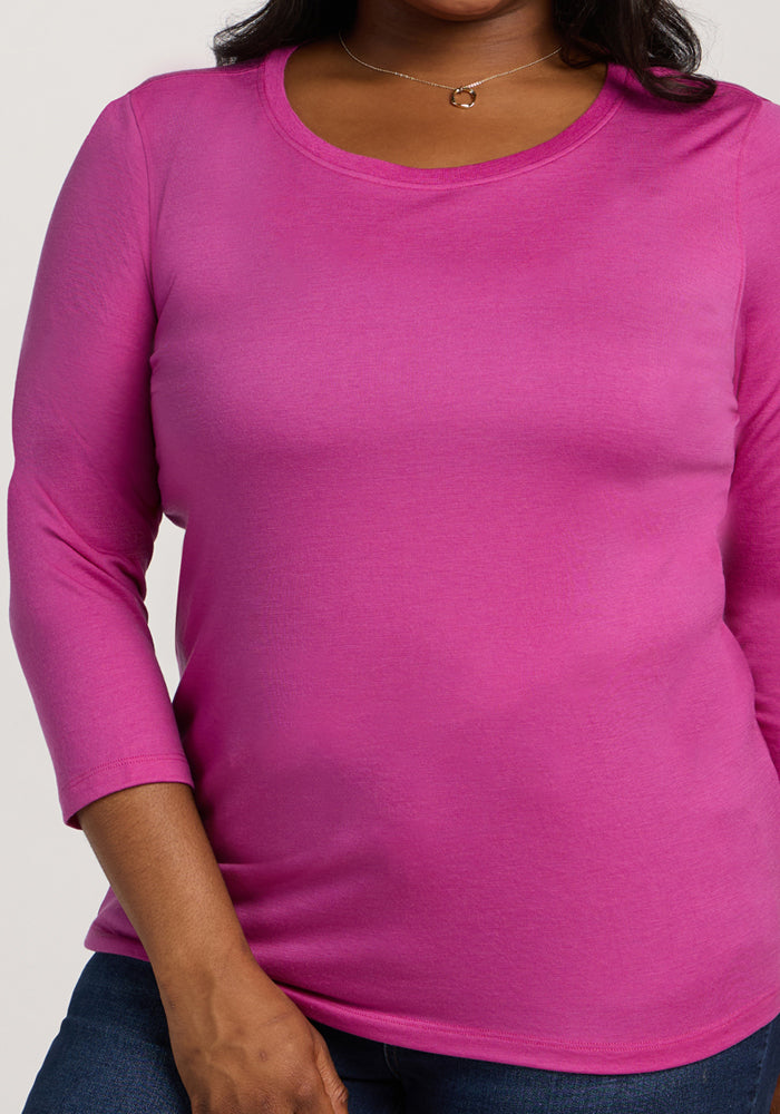 Woman wearing the Woolx Jenny 3/4 Sleeve Crew Neck in Summer Sorbet, shown from shoulders to hips with a necklace.