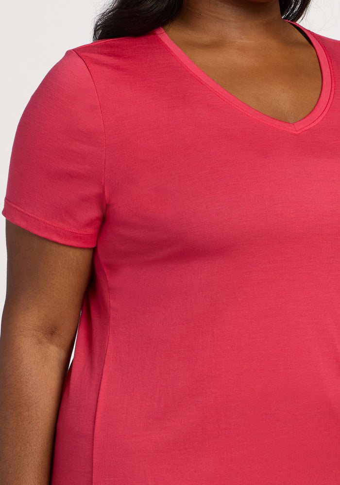 A person wearing the Woolx Junie V Neck in Berry Ice Pop, shown from shoulder to waist in a relaxed fit.
