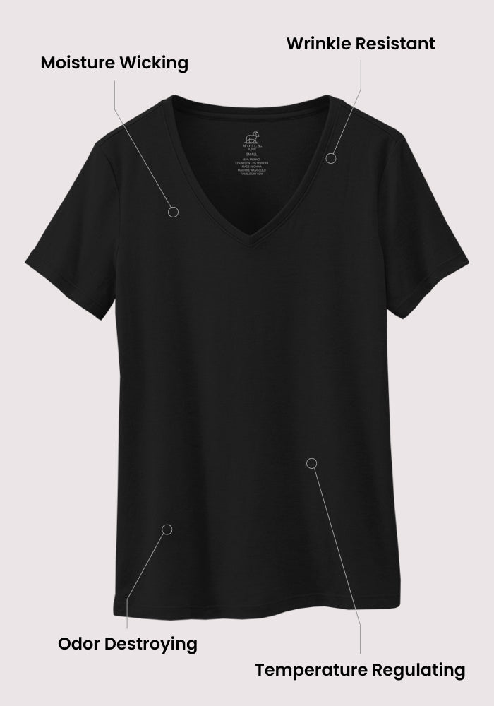 The Woolx Junie V Neck - Black for women, shown on a light background, features moisture-wicking, wrinkle-resistant, odor-destroying (odor-resistant), and temperature-regulating Merino wool with a relaxed fit design.