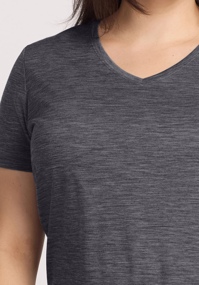 A person wears the Woolx Junie V Neck in Cinder Melange, shown from shoulders to mid-torso.
