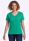 Smiling person in the Woolx Junie V Neck - Jungle, standing against a white background. | Tori is 5'7", wearing a size S