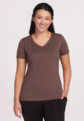 Woman with long dark hair wears the Woolx Junie V Neck - Peppercorn and black pants, smiling at the camera. | Sarah is 5'8", wearing a size S