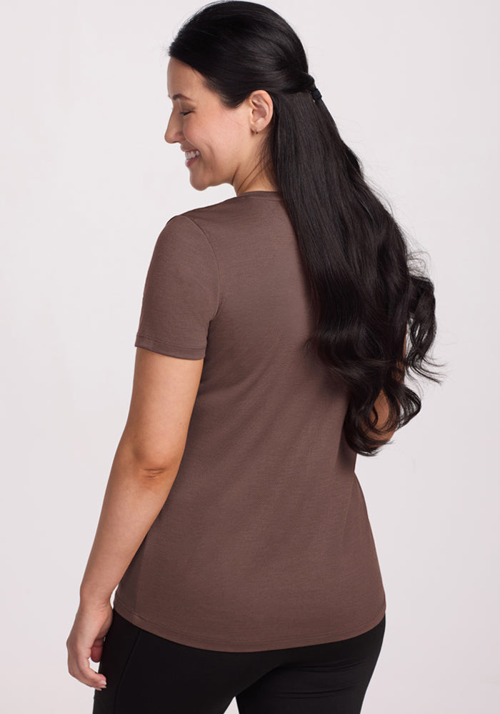 Woman with long dark hair smiles, looking left, wearing the Woolx Junie V Neck - Peppercorn Merino wool tee.