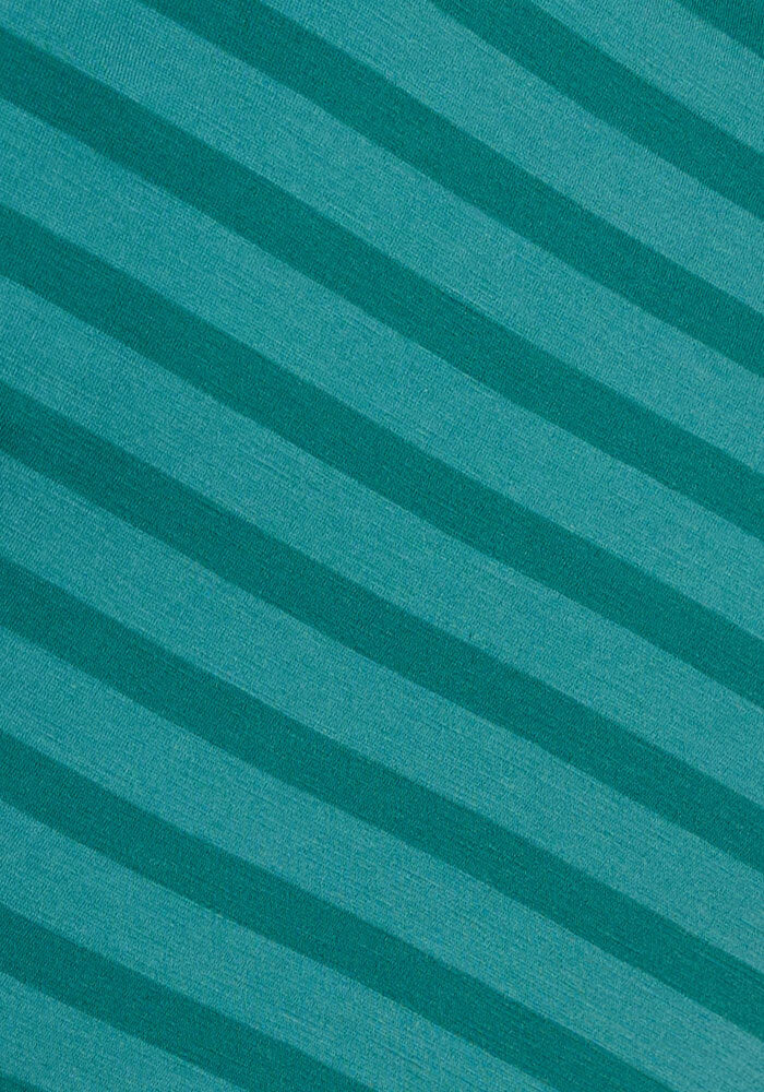 The Woolx Junie V Neck - Woodland Stripe features diagonal stripes in two teal shades on textured Merino wool, alternating from bottom left to top right for a stylish, versatile women's tee.