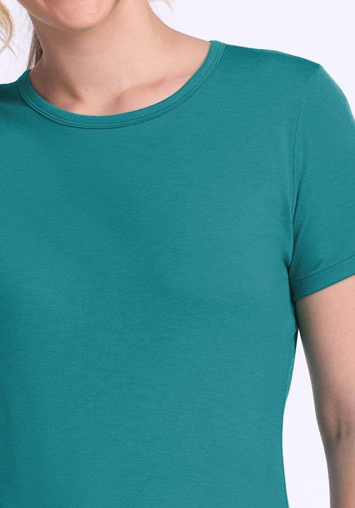Model in Woolx Liza Crew Neck Tee in Surfside, shown from shoulders to upper chest. Final Sale.