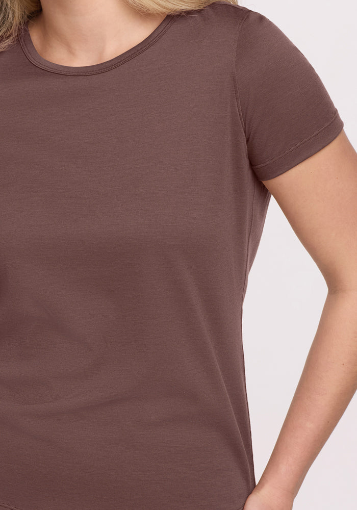 Woman wearing the Woolx Liza Crew Neck Tee in Peppercorn, shown from shoulders to waist with arm relaxed by her side.