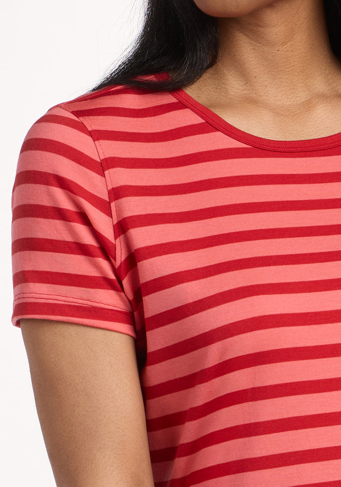 A person wearing the Woolx Liza Crew Neck Tee in Wildberry Stripe, a short-sleeve Merino wool t-shirt. Only their upper torso and part of the face are visible against a white background.